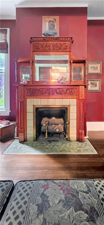 615 N Jefferson St, Carrollton, MO 64633 - detailed view of a tile fireplace and wood finished floors