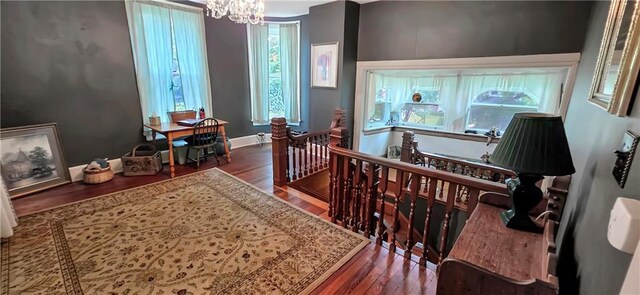 615 N Jefferson St, Carrollton, MO 64633 - office area with wood finished floors and a chandelier