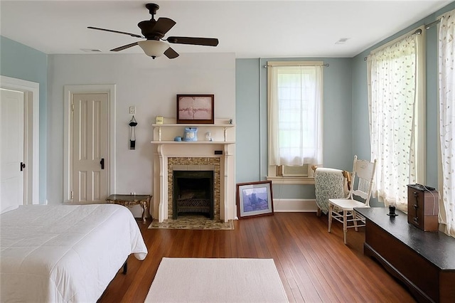 615 N Jefferson St, Carrollton, MO 64633 - bedroom featuring wood finished floors, a fireplace, and ceiling fan