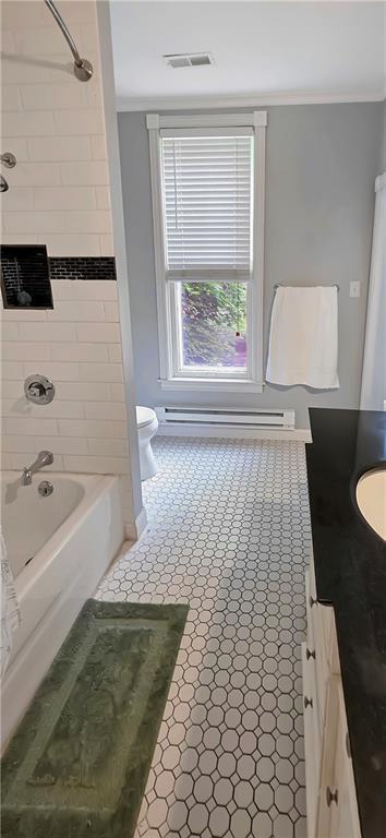 615 N Jefferson St, Carrollton, MO 64633 - full bath with vanity, ornamental molding, and bathtub / shower combination