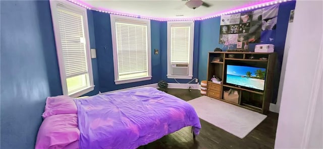 615 N Jefferson St, Carrollton, MO 64633 - bedroom featuring cooling unit and wood finished floors