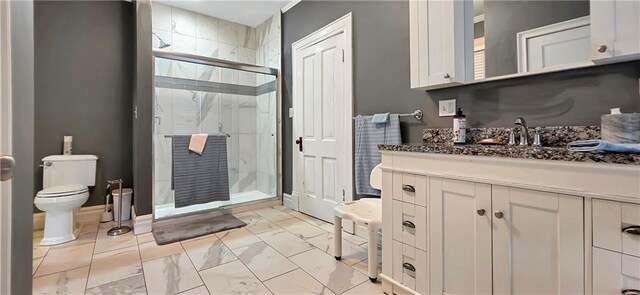 615 N Jefferson St, Carrollton, MO 64633 - bathroom with vanity, a stall shower, and marble finish floors