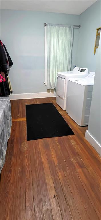 615 N Jefferson St, Carrollton, MO 64633 - laundry area with washing machine and dryer and wood finished floors