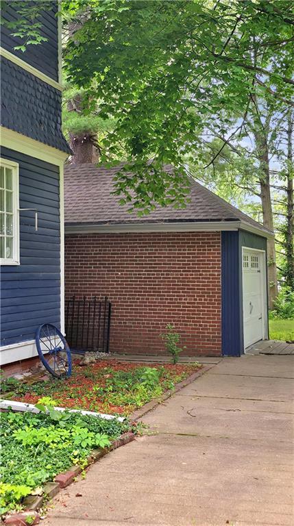 615 N Jefferson St, Carrollton, MO 64633 - view of property exterior featuring roof with shingles