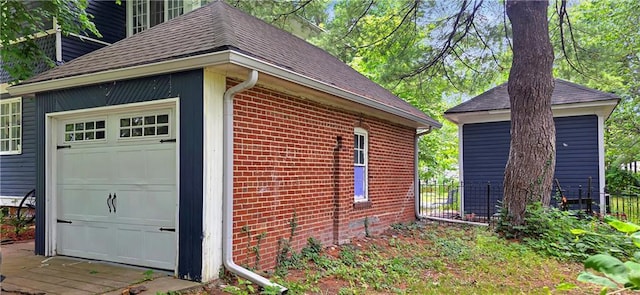 615 N Jefferson St, Carrollton, MO 64633 - view of property exterior featuring brick siding and a shingled roof