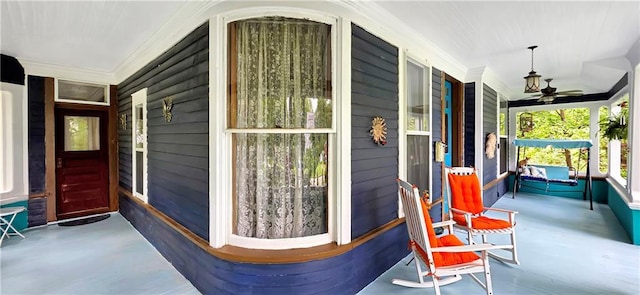 615 N Jefferson St, Carrollton, MO 64633 - covered porch featuring a ceiling fan