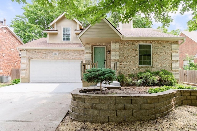 13821 S Shannan St, Olathe, KS 66062 - view of front of house featuring concrete driveway, a shingled roof, brick siding, and a chimney