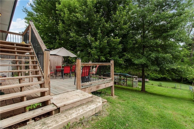 117 Ellison Way, Independence, MO 64050 - view of green lawn with stairs, outdoor dining area, and a wooden deck