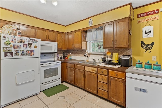 117 Ellison Way, Independence, MO 64050 - kitchen featuring white appliances, brown cabinetry, tasteful backsplash, a textured ceiling, and crown molding