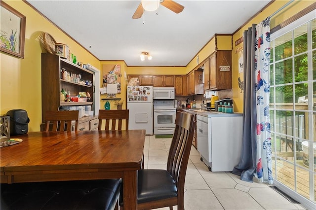 117 Ellison Way, Independence, MO 64050 - dining area with light tile patterned floors, a ceiling fan, and ornamental molding