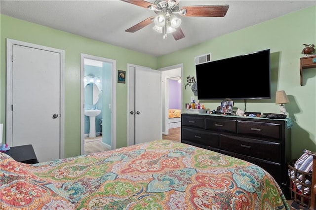 117 Ellison Way, Independence, MO 64050 - bedroom featuring ensuite bath, wood finished floors, and ceiling fan