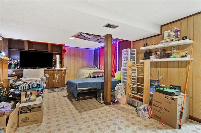 117 Ellison Way, Independence, MO 64050 - bedroom featuring wooden walls and a textured ceiling