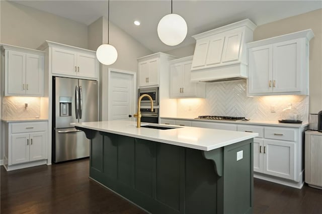 144 SE Riley St, Blue Springs, MO 64064 - kitchen with appliances with stainless steel finishes, dark wood-type flooring, tasteful backsplash, light countertops, and recessed lighting