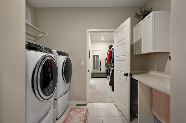 144 SE Riley St, Blue Springs, MO 64064 - laundry room featuring cabinet space, separate washer and dryer, light carpet, and light tile patterned flooring