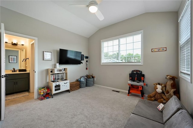144 SE Riley St, Blue Springs, MO 64064 - carpeted living area with vaulted ceiling and a ceiling fan