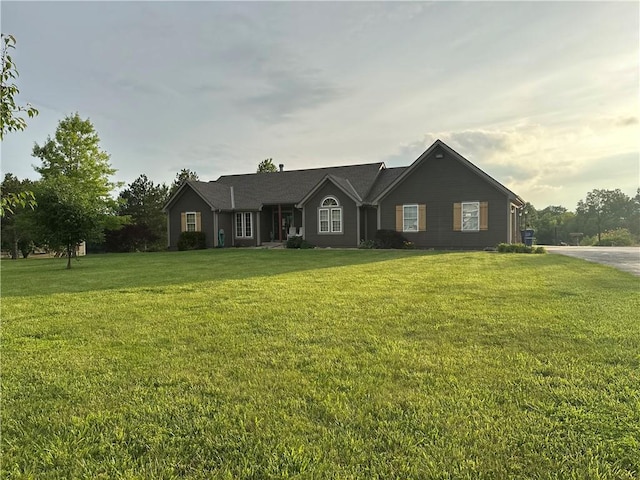 23800 Lucille Ln, Peculiar, MO 64078 - ranch-style house featuring a front lawn