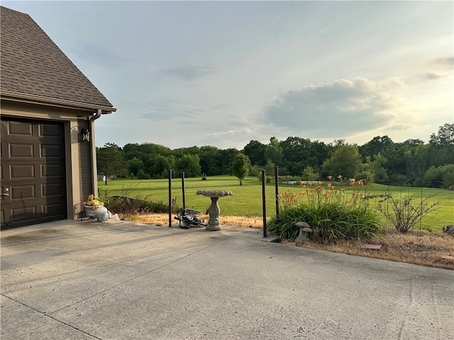 23800 Lucille Ln, Peculiar, MO 64078 - view of grassy yard featuring a garage and driveway