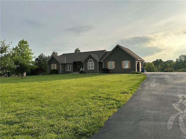 23800 Lucille Ln, Peculiar, MO 64078 - ranch-style home featuring a front lawn and driveway