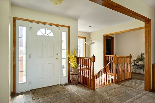 23800 Lucille Ln, Peculiar, MO 64078 - foyer entrance featuring dark stone finish floors and baseboards