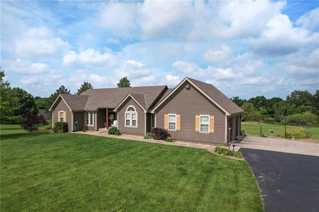 23800 Lucille Ln, Peculiar, MO 64078 - ranch-style home with asphalt driveway, a front lawn, and an attached garage