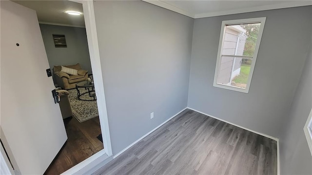 4216 E 67th Ter, Kansas City, MO 64132 - empty room featuring wood finished floors and crown molding
