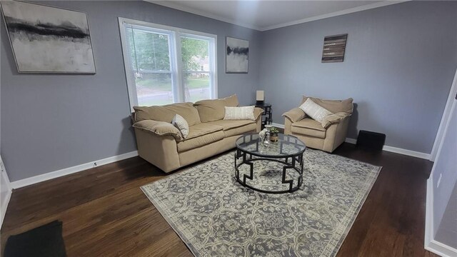 4216 E 67th Ter, Kansas City, MO 64132 - living area featuring dark wood-style floors and ornamental molding