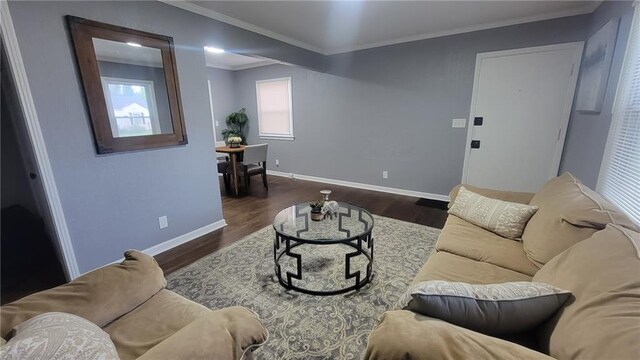 4216 E 67th Ter, Kansas City, MO 64132 - living area with dark wood-style flooring and ornamental molding