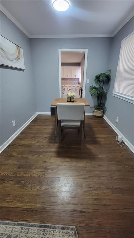 4216 E 67th Ter, Kansas City, MO 64132 - dining area featuring dark wood-style floors and ornamental molding
