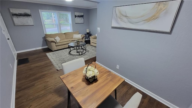 4216 E 67th Ter, Kansas City, MO 64132 - living room with wood finished floors and crown molding