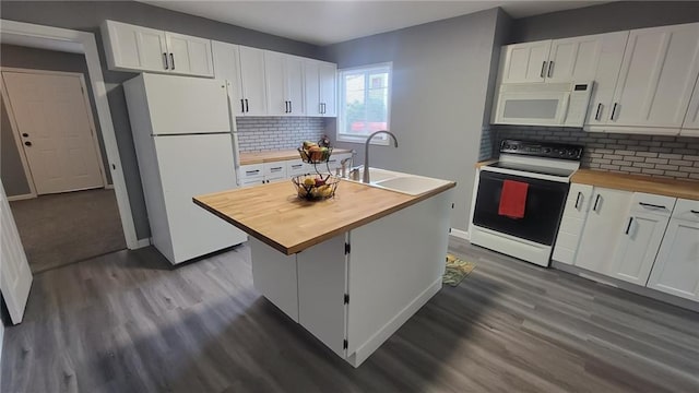 4216 E 67th Ter, Kansas City, MO 64132 - kitchen featuring butcher block countertops, white appliances, dark wood finished floors, and white cabinets