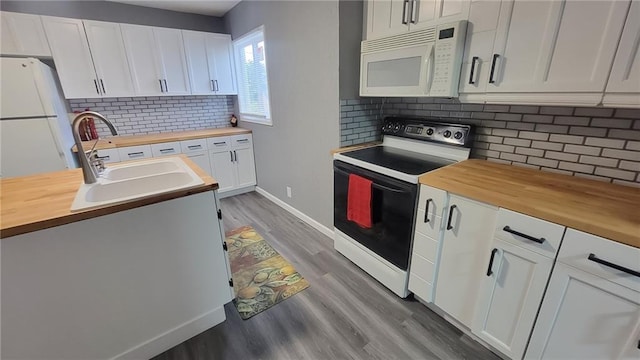 4216 E 67th Ter, Kansas City, MO 64132 - kitchen featuring wooden counters, white appliances, light wood-type flooring, and white cabinets