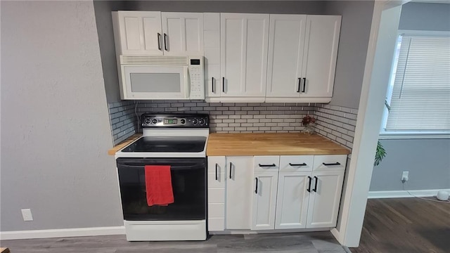 4216 E 67th Ter, Kansas City, MO 64132 - kitchen featuring white microwave, range with electric stovetop, and wood finished floors