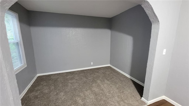4216 E 67th Ter, Kansas City, MO 64132 - unfurnished room with dark carpet and baseboards