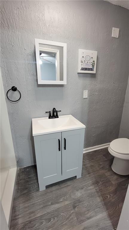 4216 E 67th Ter, Kansas City, MO 64132 - bathroom with wood finished floors and vanity