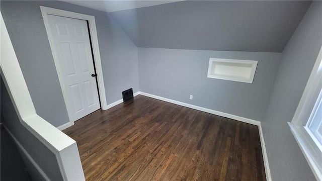 4216 E 67th Ter, Kansas City, MO 64132 - bonus room with dark wood-style floors and lofted ceiling