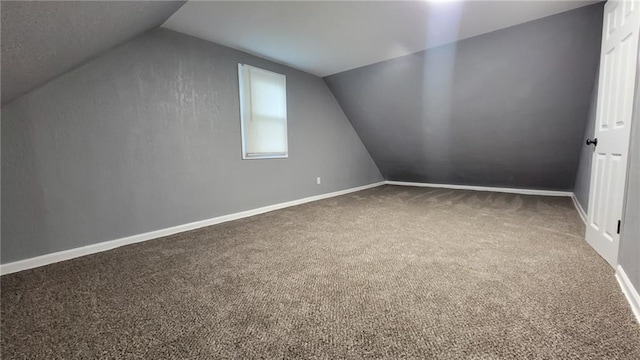 4216 E 67th Ter, Kansas City, MO 64132 - additional living space with carpet and lofted ceiling