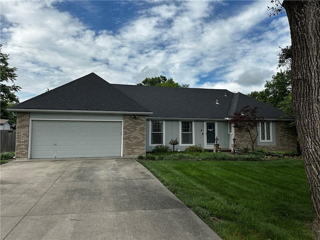 1902 Snowdrop Cir, Liberty, MO 64068 - single story home with driveway, a garage, a front yard, and brick siding