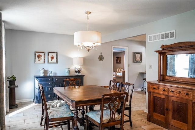 1902 Snowdrop Cir, Liberty, MO 64068 - dining area featuring light tile patterned flooring and a chandelier