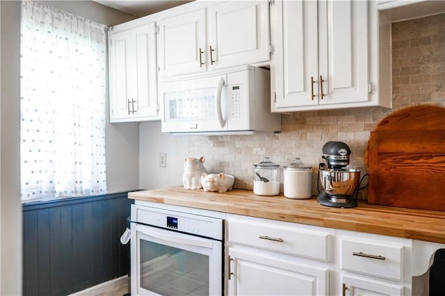 1902 Snowdrop Cir, Liberty, MO 64068 - kitchen with white appliances, butcher block counters, white cabinetry, and backsplash