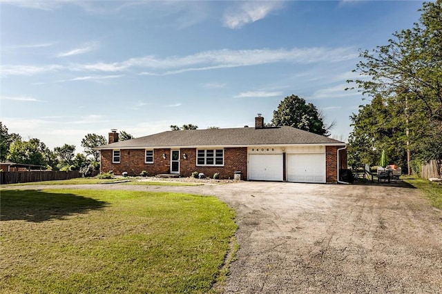 34065 W 135th St, Olathe, KS 66061 - ranch-style home with a chimney, an attached garage, asphalt driveway, and brick siding