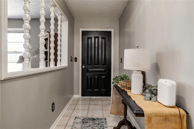 34065 W 135th St, Olathe, KS 66061 - entrance foyer featuring a textured ceiling and light tile patterned floors