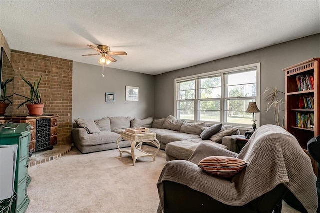 34065 W 135th St, Olathe, KS 66061 - carpeted living room featuring ceiling fan and a textured ceiling