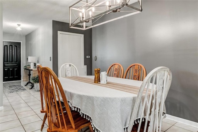 34065 W 135th St, Olathe, KS 66061 - dining area featuring light tile patterned floors and a chandelier
