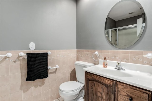 34065 W 135th St, Olathe, KS 66061 - bathroom featuring vanity, a shower with door, and tile walls