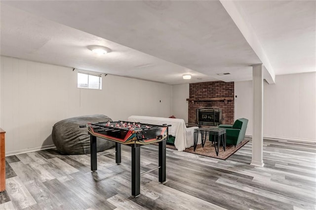 34065 W 135th St, Olathe, KS 66061 - playroom with wood finished floors and a brick fireplace
