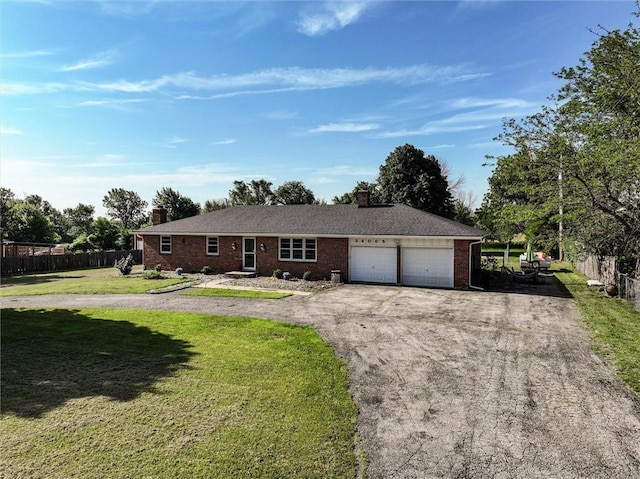 34065 W 135th St, Olathe, KS 66061 - ranch-style house with a chimney, asphalt driveway, an attached garage, and brick siding