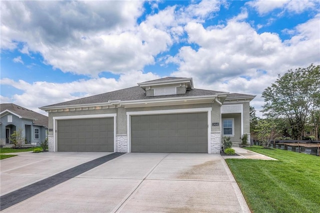24110 W 95th St, Lenexa, KS 66227 - prairie-style house featuring driveway, a front lawn, an attached garage, stone siding, and roof with shingles