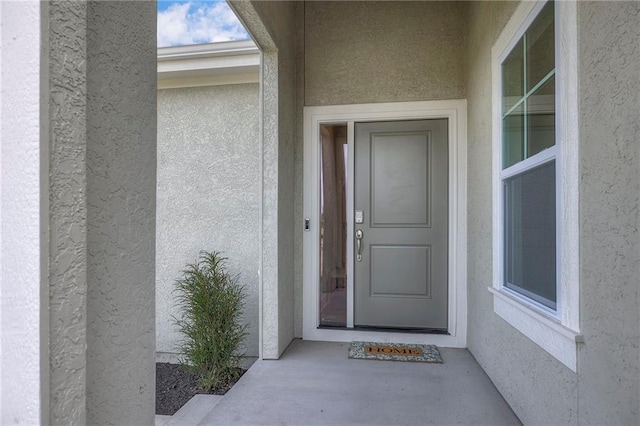 24110 W 95th St, Lenexa, KS 66227 - view of exterior entry featuring stucco siding
