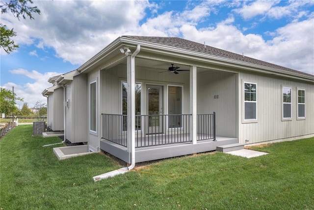 24110 W 95th St, Lenexa, KS 66227 - rear view of house with a lawn, a ceiling fan, and roof with shingles
