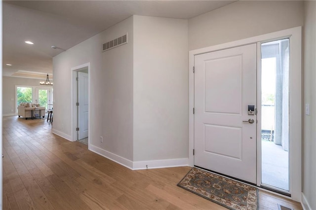 24110 W 95th St, Lenexa, KS 66227 - foyer entrance featuring hardwood / wood-style floors, a chandelier, and recessed lighting